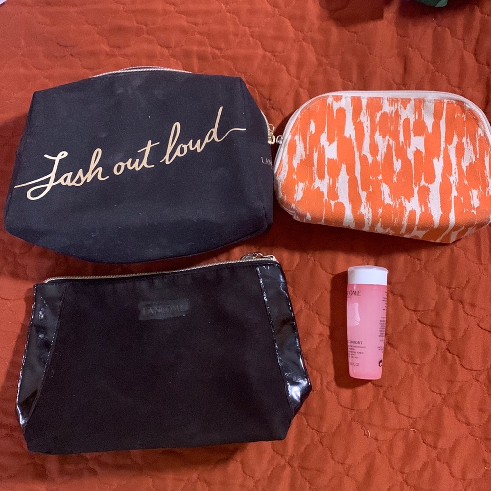 3 makeup case and 1 Lancôme Toner